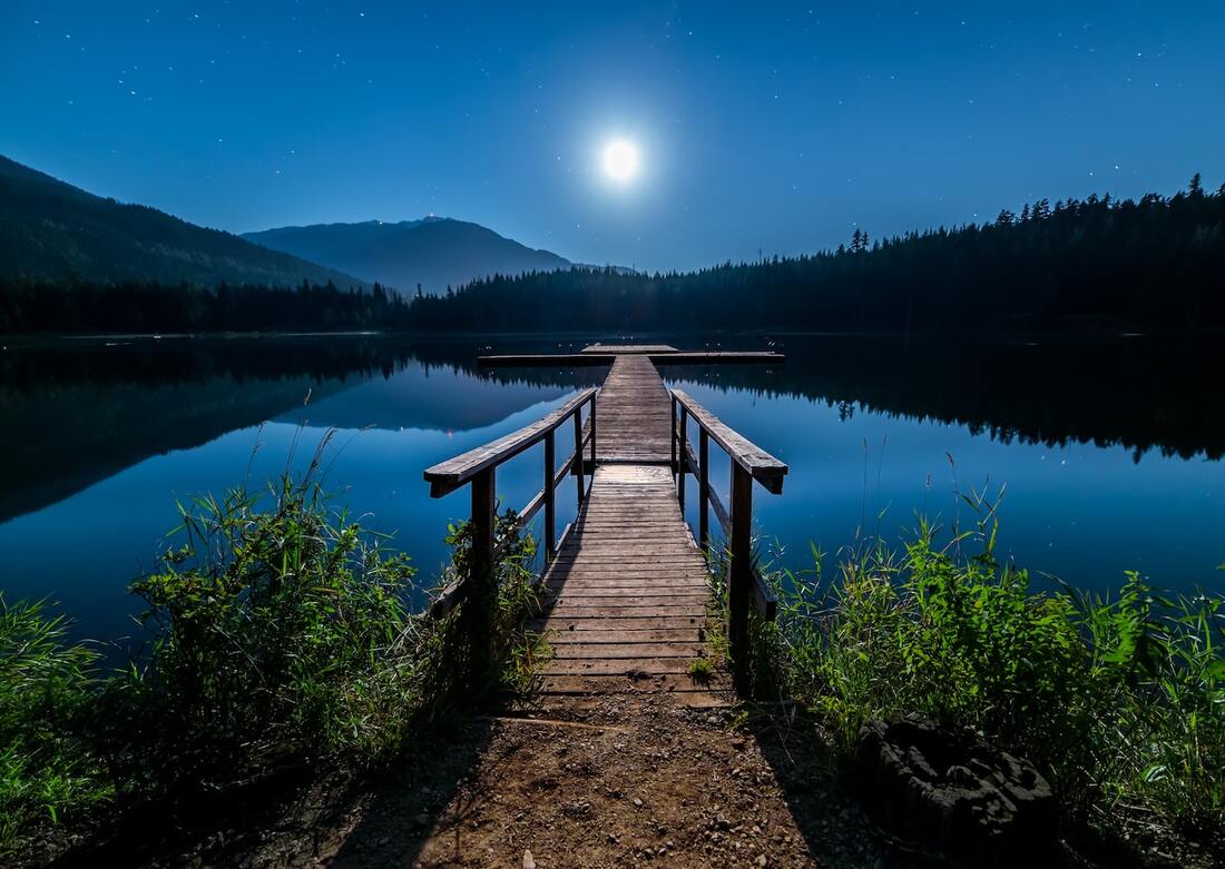 self control analogy with moonlit night over lake and dock